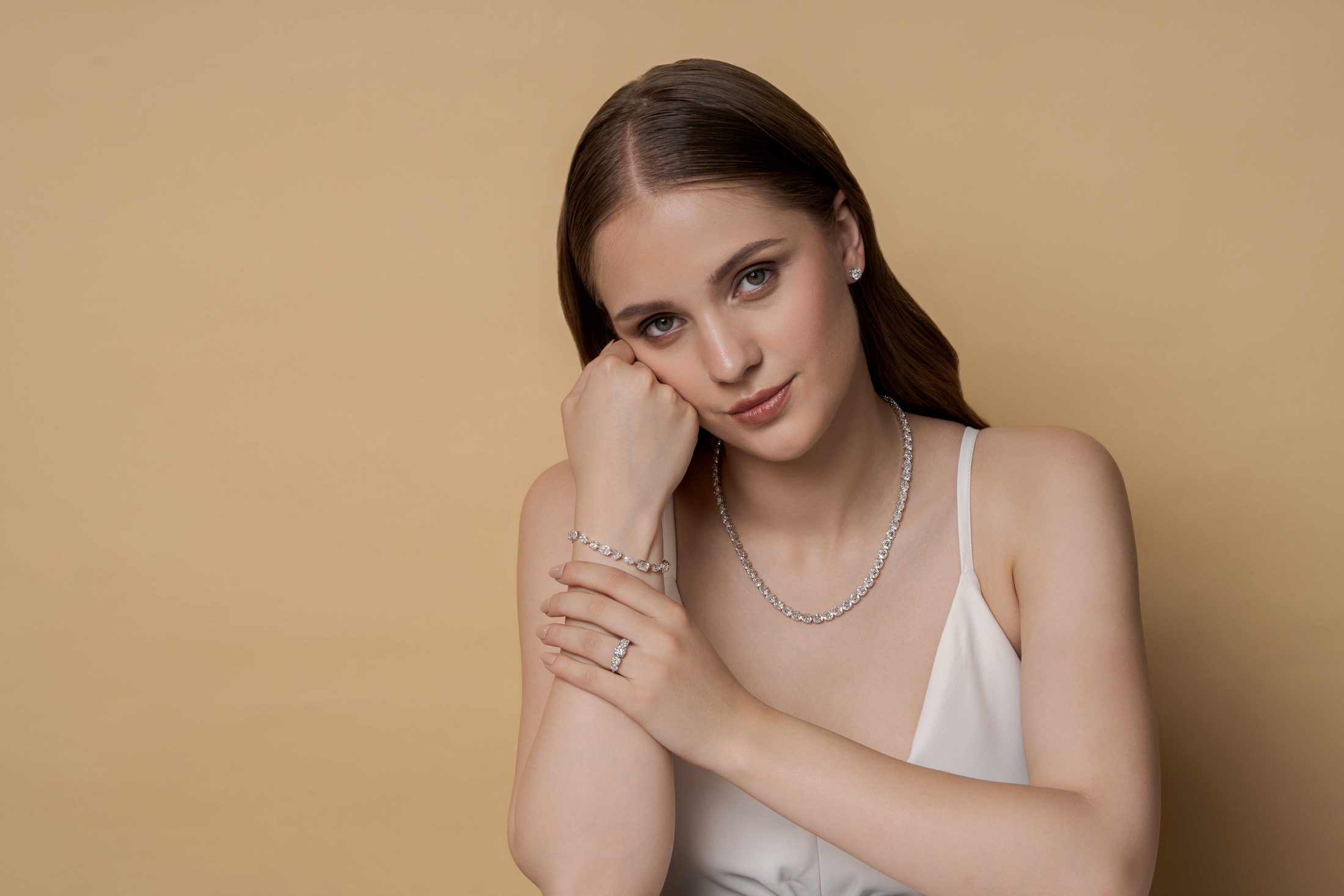 Model wearing an EverCarats diamond tennis necklace, bracelet, and ring